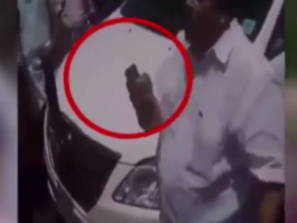 Kerala MLA PC George points gun at estate workers, threatens to pour acid on them Kerala MLA PC George points gun at estate workers, threatens to pour acid on them