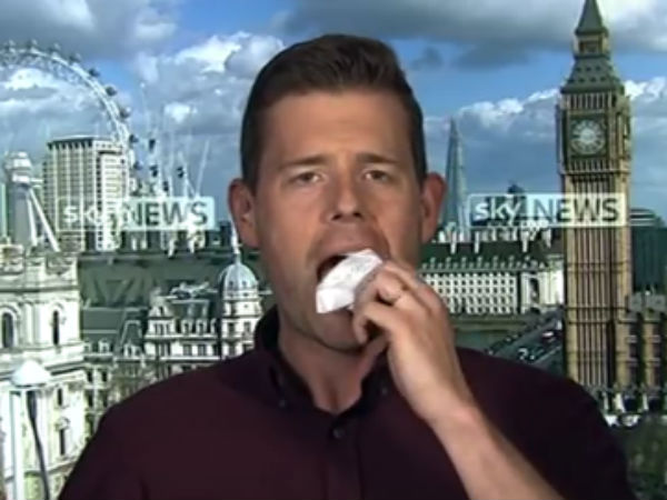 Politics professor eats book live on air after promising to eat his words Politics professor eats book live on air after promising to eat his words