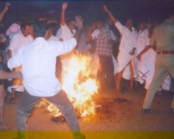 DMK cadres burning the effigy of Vedanthi
