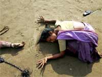 A Mother cries for her child's death in Tsunami attack A Mother cries for her child's death in Tsunami attack