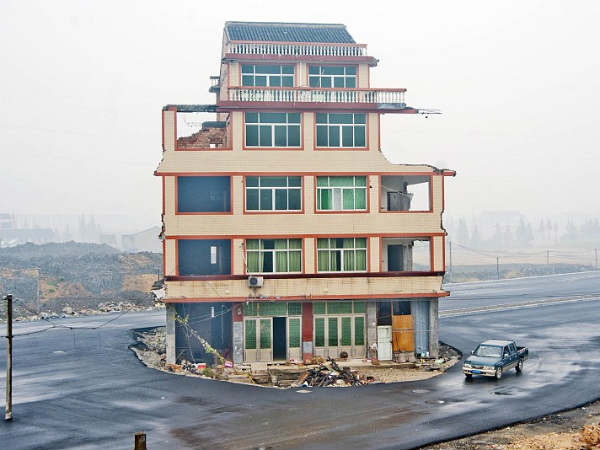 Road is built around a house after elderly Chinese couple refuse to move Road is built around a house after elderly Chinese couple refuse to move