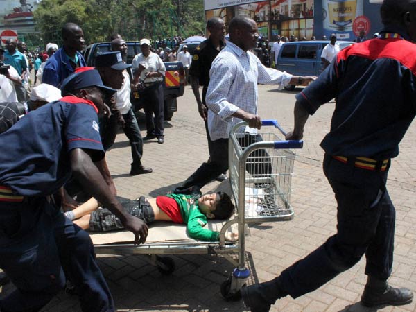 A injured child is wheeled away on a shopping trolley outside the Westgate Mall in Nairobi, Kenya A injured child is wheeled away on a shopping trolley outside the Westgate Mall in Nairobi, Kenya