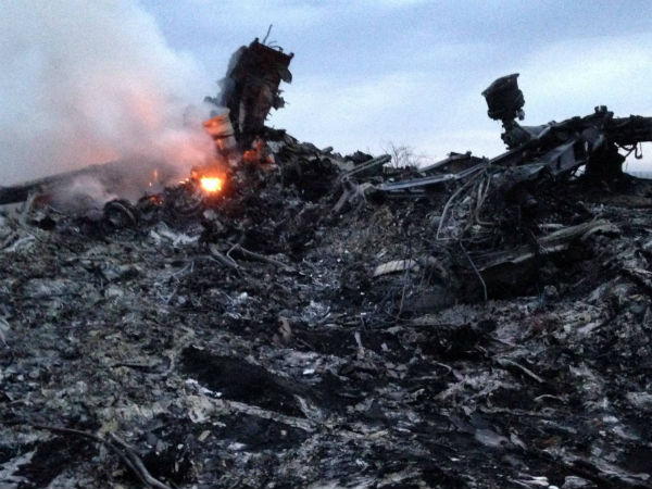 More than 100 bodies in Malaysian flight crash site, says Ukraine official More than 100 bodies in Malaysian flight crash site, says Ukraine official