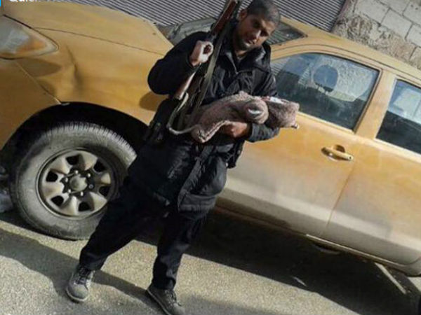 Indian-origin ISIS member poses with AK-47, newborn on Twitter Indian-origin ISIS member poses with AK-47, newborn on Twitter