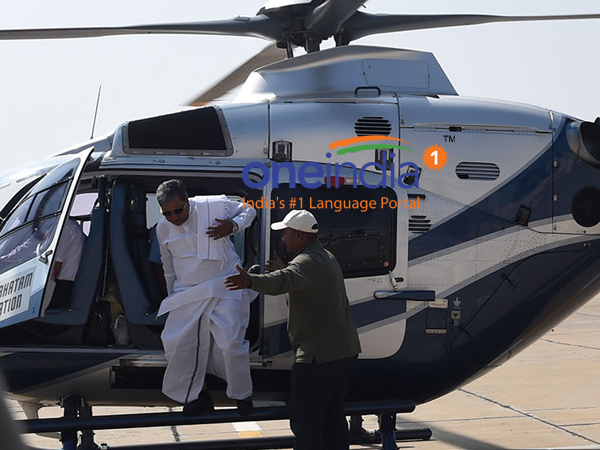 Siddaramaiah unhurt after his chopper catches fire Siddaramaiah unhurt after his chopper catches fire