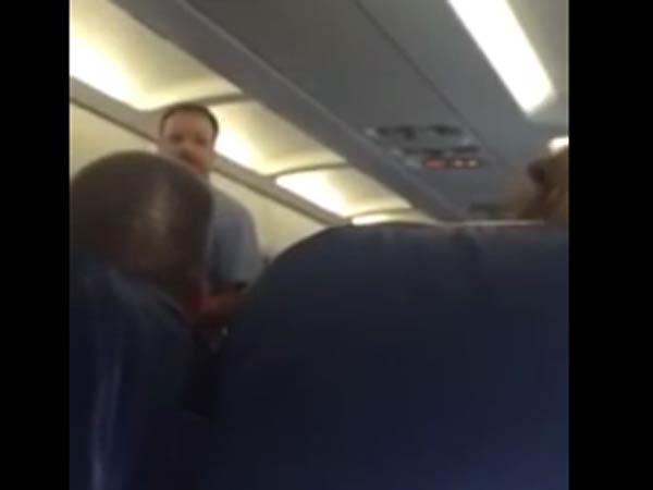 US woman thrown off from a flight for weeping US woman thrown off from a flight for weeping