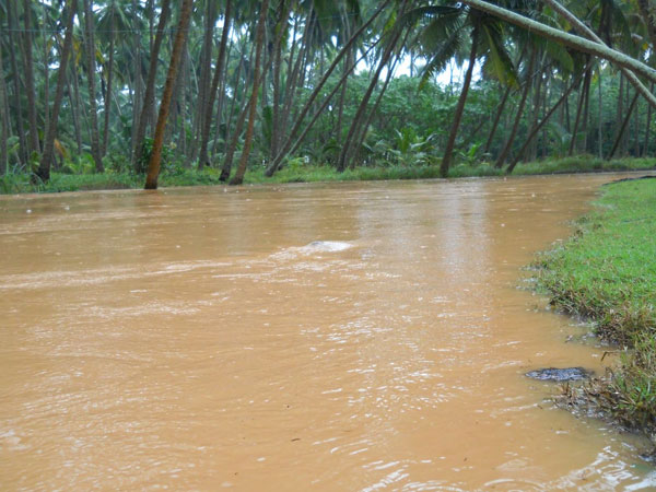 Road bridge washed away in flood waters Road bridge washed away in flood waters