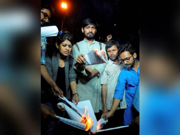 Students, ABVP members burn Manusmriti Students, ABVP members burn Manusmriti