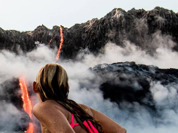This lady swims near boling Lava of a Volcano This lady swims near boling Lava of a Volcano