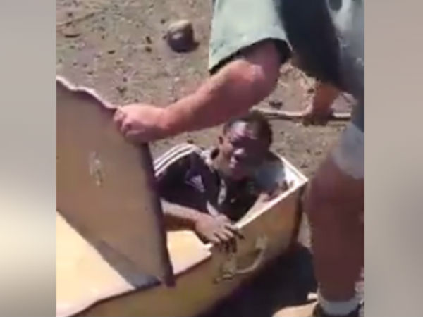 South Africa white man arrested for forcing a black man into a coffin South Africa white man arrested for forcing a black man into a coffin