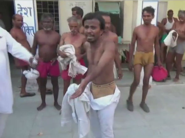 Madhya Pradesh police accused of thrashing and making farmers strip down Madhya Pradesh police accused of thrashing and making farmers strip down