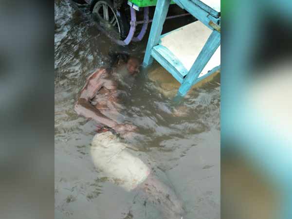 A old beggar man died after draining in Marina flood A old beggar man died after draining in Marina flood
