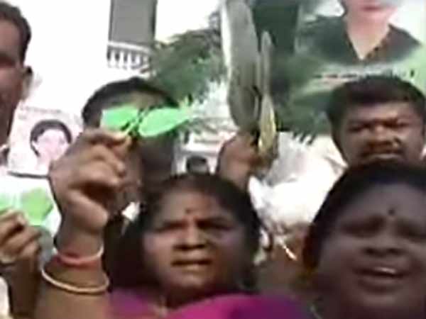 ADMK workers firing crackers and sharing sweets to each ADMK workers firing crackers and sharing sweets to each