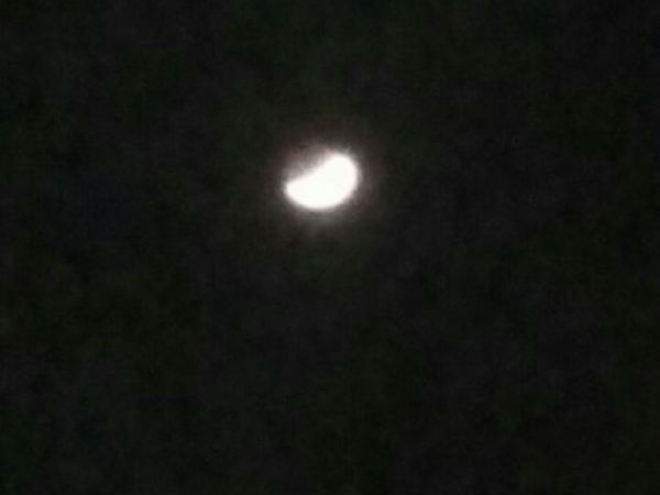 People enjoying the lunar eclipse in their terrace People enjoying the lunar eclipse in their terrace