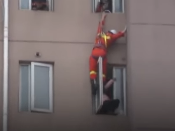 Chinese Fire Fighter Saves Suicidal Women By Kicking Her Back Chinese Fire Fighter Saves Suicidal Women By Kicking Her Back