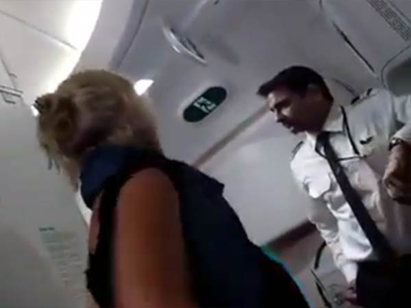 Irish Passenger abuses Air India Pilot for not giving another glass of wine. Irish Passenger abuses Air India Pilot for not giving another glass of wine.