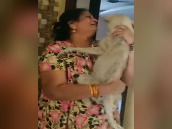 The Lady who expresses happiness that her Dog Babblu returned The Lady who expresses happiness that her Dog Babblu returned