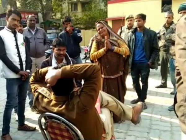 Up cop suspended after video of elderly woman falling at his feet goes viral Up cop suspended after video of elderly woman falling at his feet goes viral