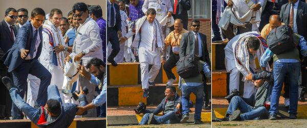 Rahul Gandhi helps a photographer who fell at Bhubaneswar Airport, Odisha Rahul Gandhi helps a photographer who fell at Bhubaneswar Airport, Odisha