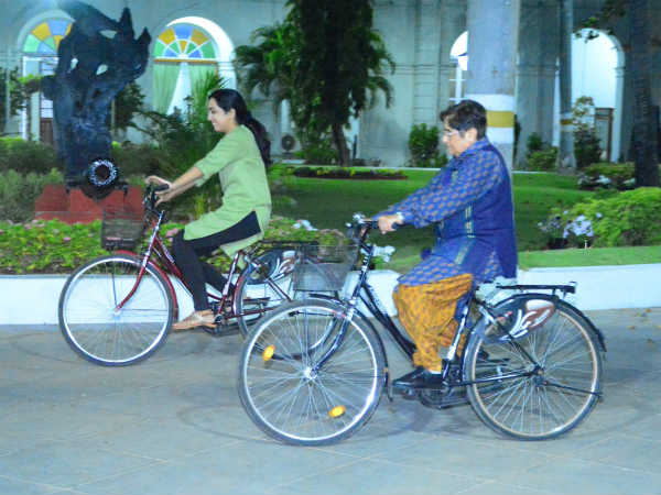 Lets go for a ride, Kiran Bedi rides in cycle inside governor home while Narayanasamy protests Lets go for a ride, Kiran Bedi rides in cycle inside governor home while Narayanasamy protests