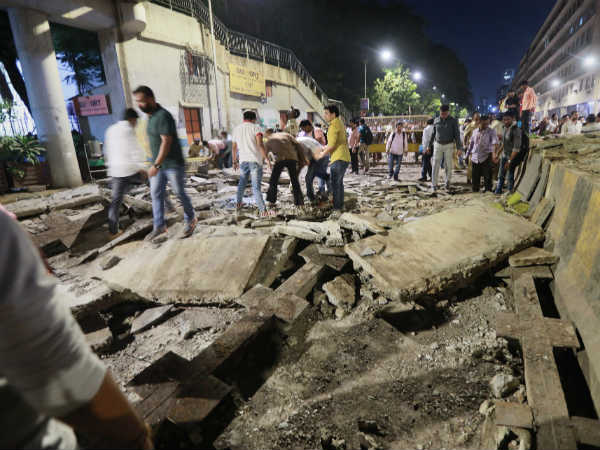 Mumbai: A foot over bridge near Chhatrapati Shivaji Maharaj Terminus (CSMT) railway station has collapsed. Mumbai: A foot over bridge near Chhatrapati Shivaji Maharaj Terminus (CSMT) railway station has collapsed.