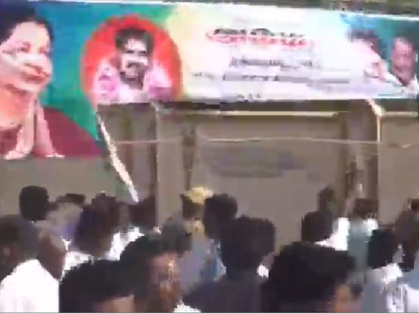 AMMK caders tear ADMK banners AMMK caders tear ADMK banners