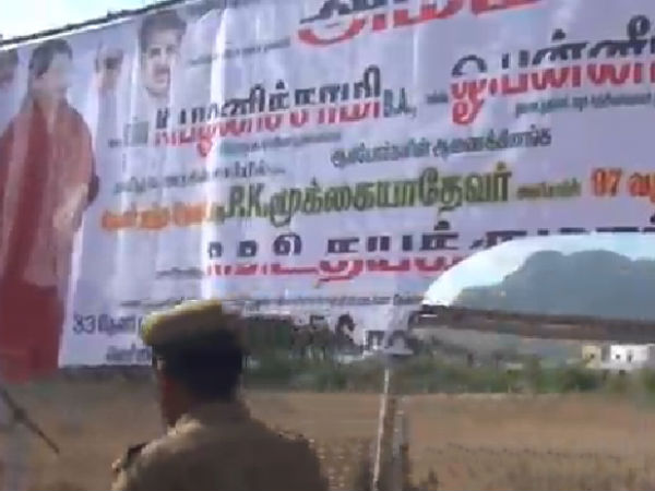 AMMK caders tear ADMK banners AMMK caders tear ADMK banners