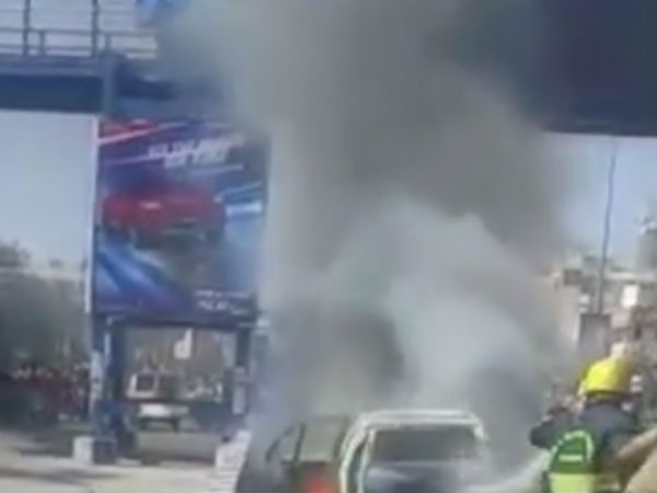 Car catches fire while going on the road in Chennai Car catches fire while going on the road in Chennai