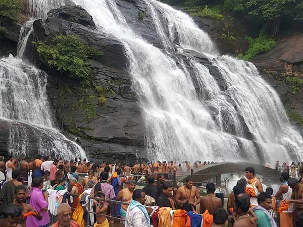 Tourists crowd in Coutrallam water falls for Mitigated Summer heat Tourists crowd in Coutrallam water falls for Mitigated Summer heat