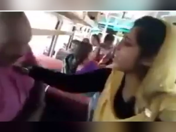 Young Girl attacked old man in running bus video Young Girl attacked old man in running bus video