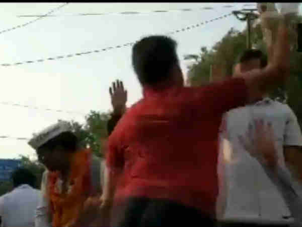 A man slaps Delhi Chief Minister Arvind Kejriwal during his roadshow A man slaps Delhi Chief Minister Arvind Kejriwal during his roadshow