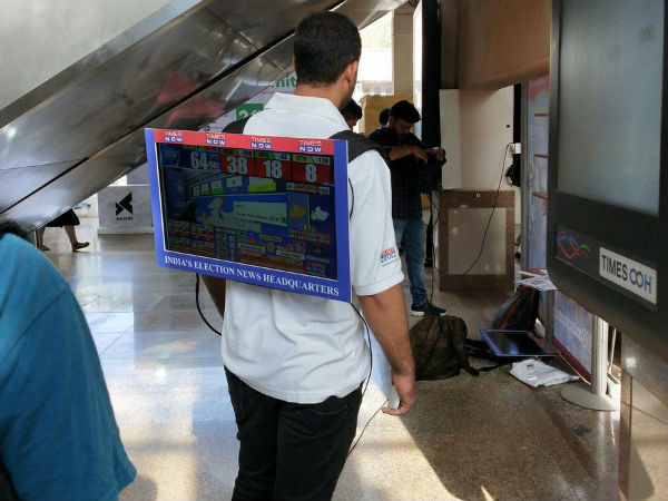 youth wears tv on his back shows election results for others youth wears tv on his back shows election results for others