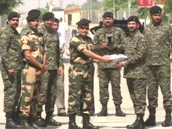 India - Pakistan counterparts exchange sweets in Attari-Wagah border India - Pakistan counterparts exchange sweets in Attari-Wagah border