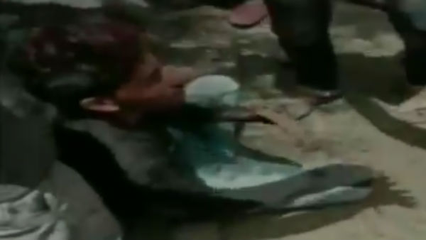 man forced to rub nose on shoes man forced to rub nose on shoes