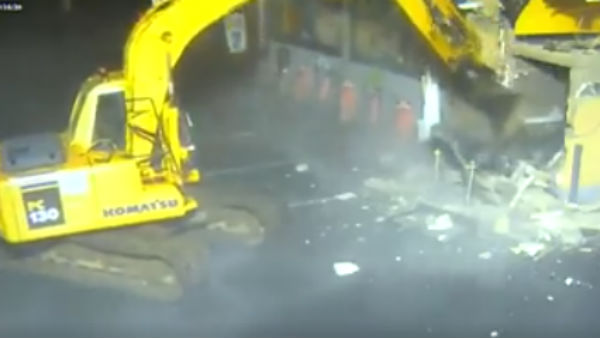 An ATM mechine taken away by a big fulldosar An ATM mechine taken away by a big fulldosar