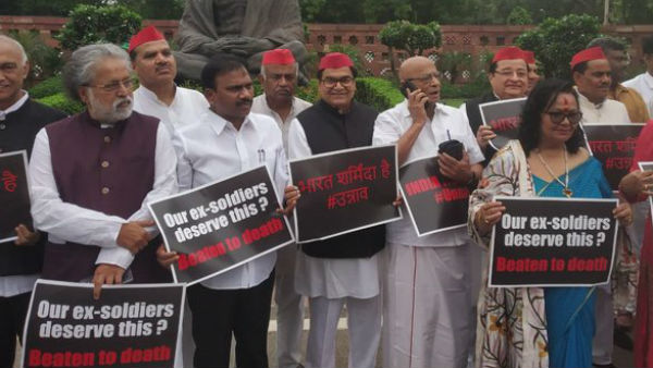 MPs protest in front of Mahatma Gandhis statue at the Parliament premises over UP murders MPs protest in front of Mahatma Gandhis statue at the Parliament premises over UP murders