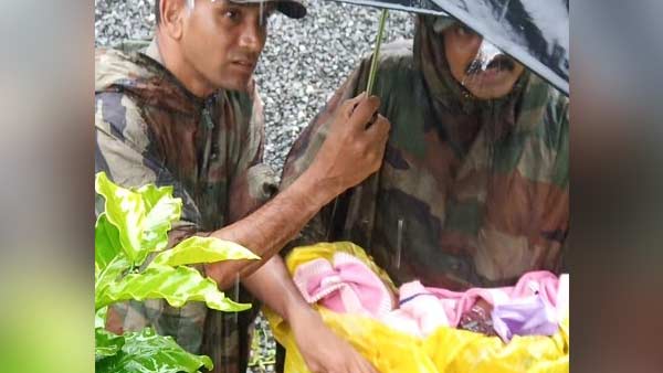 Army Personnel rescues a new born baby from Wayanad, Kerala Army Personnel rescues a new born baby from Wayanad, Kerala