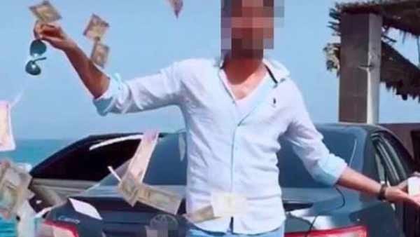 Asian man arrested in Dubai for throwing currencies in public place Asian man arrested in Dubai for throwing currencies in public place