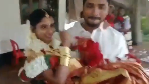 திருமண வீட்டை சுற்றி வெள்ளம்.. மணமகள் கால் தரையில் படாமல்.. தூக்கி கொண்ட மணமகன் 