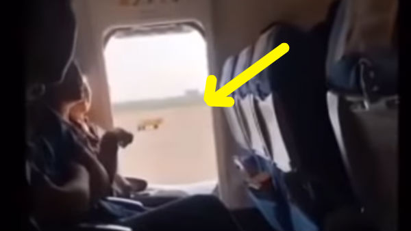 Plane Passenger opens emergency door Plane Passenger opens emergency door
