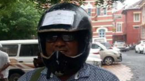 man sticks vehicle documents on helmet to avoid fines man sticks vehicle documents on helmet to avoid fines