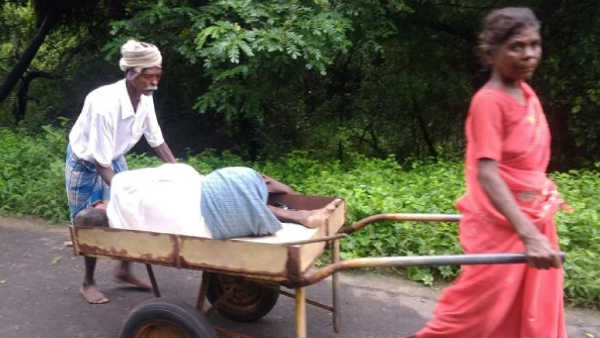 A woman takes her brothers dead body in hand cart A woman takes her brothers dead body in hand cart