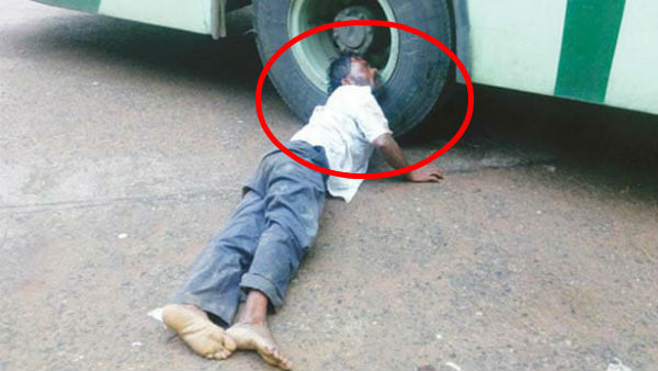 drunken man sleeping in bus wheel in aranthangi bus stand drunken man sleeping in bus wheel in aranthangi bus stand