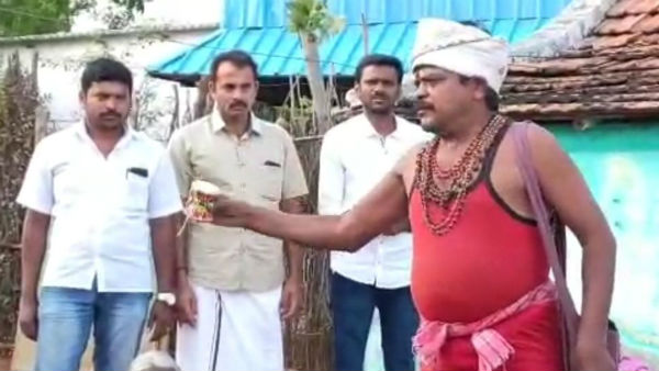 கையில் உடுக்கையுடன்