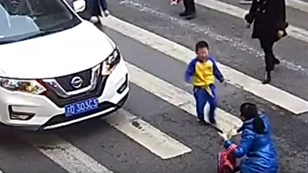Boy in China goes anger after car hits his mother Boy in China goes anger after car hits his mother