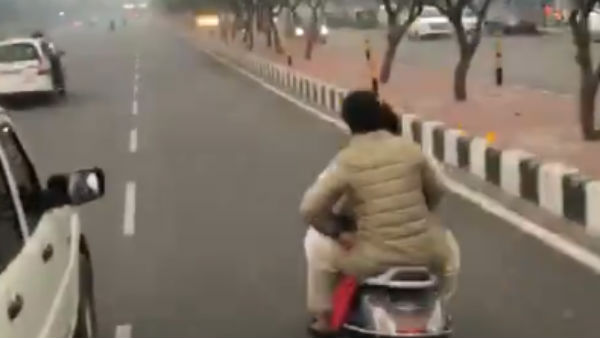 Congress General Secretary Priyanka Gandhi travelled in a two wheeler without helmet Congress General Secretary Priyanka Gandhi travelled in a two wheeler without helmet