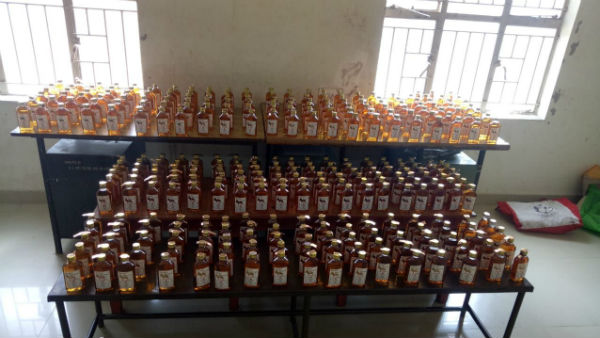 Two women arrested for abducting liquor bottles from Puducherry Two women arrested for abducting liquor bottles from Puducherry