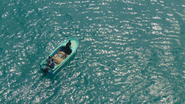 Naval helicopter from Indian Naval Air Station, Ramnad intercepted a Srilankan boat within Indian waters Naval helicopter from Indian Naval Air Station, Ramnad intercepted a Srilankan boat within Indian waters
