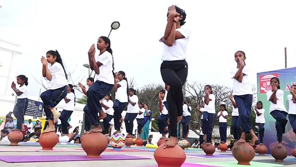 In Puducherry Beach Road School students perform various yoga poses In Puducherry Beach Road School students perform various yoga poses