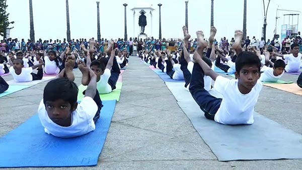 In Puducherry Beach Road School students perform various yoga poses In Puducherry Beach Road School students perform various yoga poses